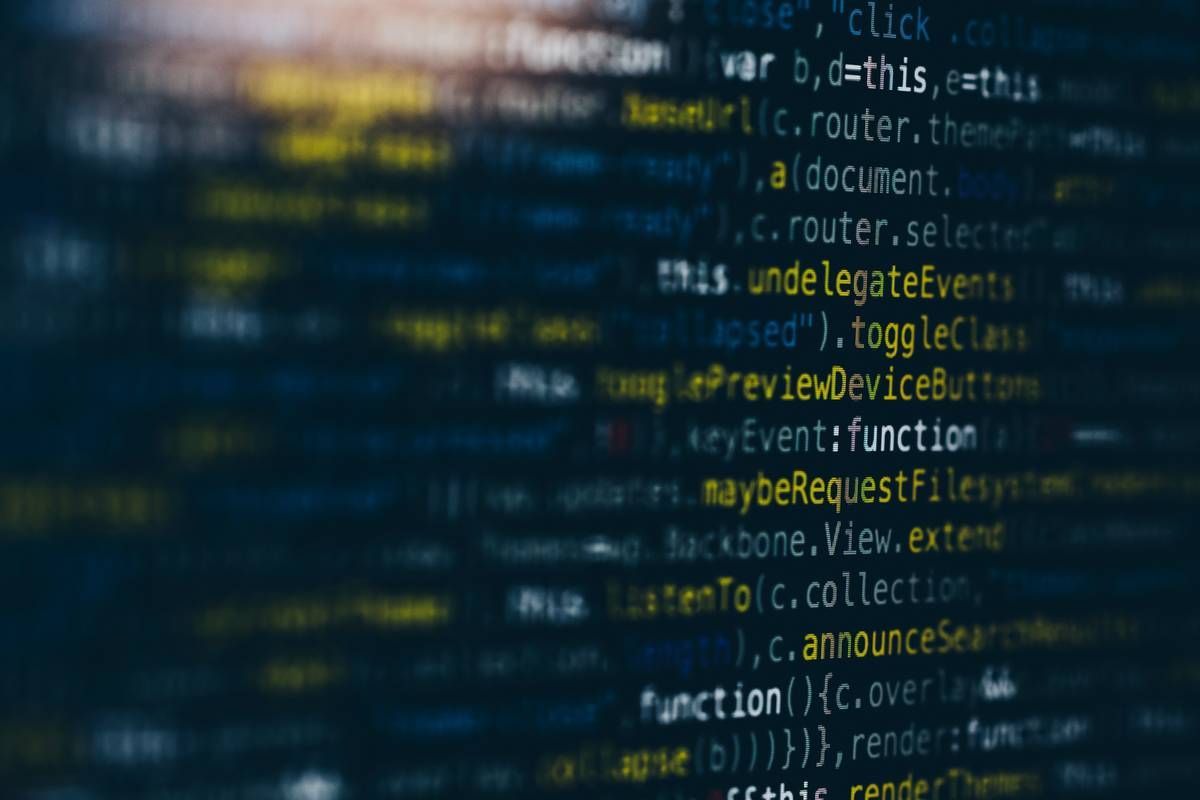 Engineer analyzing codec rating data on multi-screen dashboard